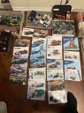 Assorted Lego sets , completed cars, figures and colour assorted also with Manuel booklets Lego